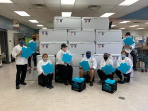 Food service staff with coolers and ice sheets purchased through Jewel-Osco foundation grant