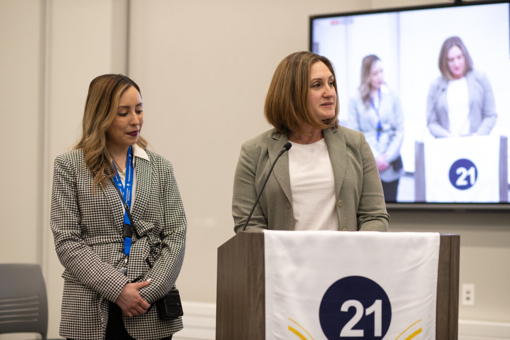 Julie Brash, the new assistant principal at Field Elementary School, addresses the board shortly after an introduction by Field Principal Crystal Jimenez (left)