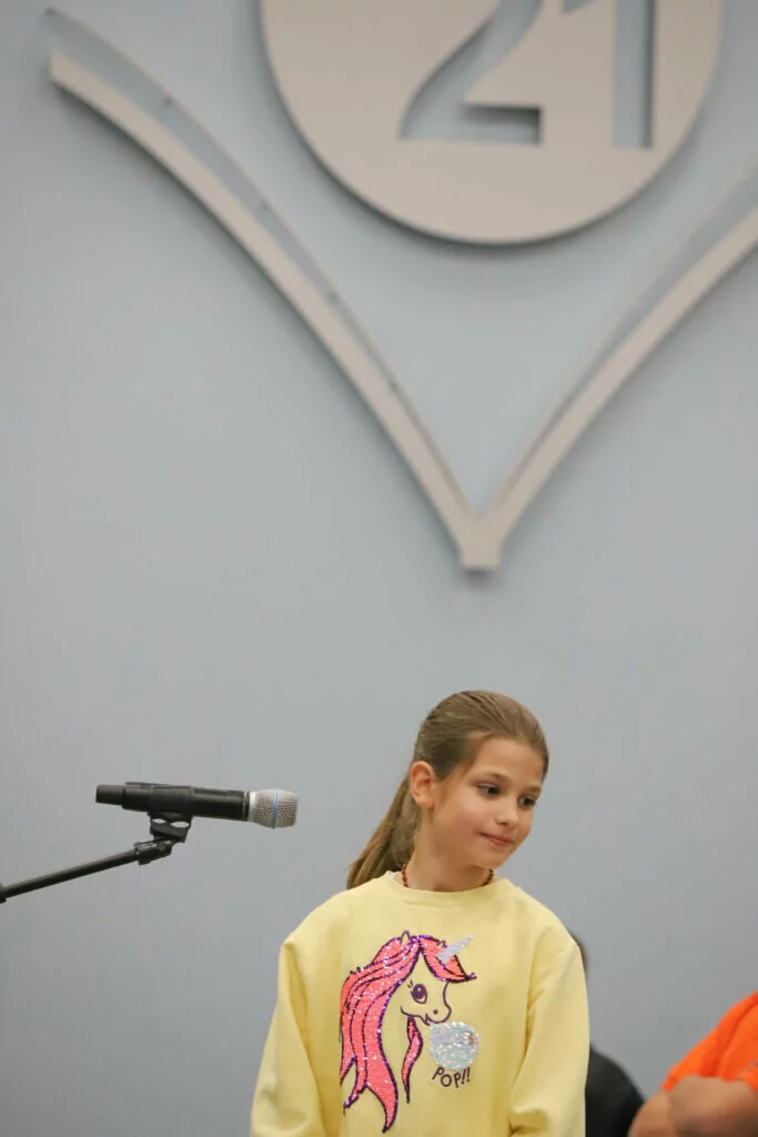 Emili K., a fourth grader at Poe Elementary School, returns to her seat after correctly spelling a word