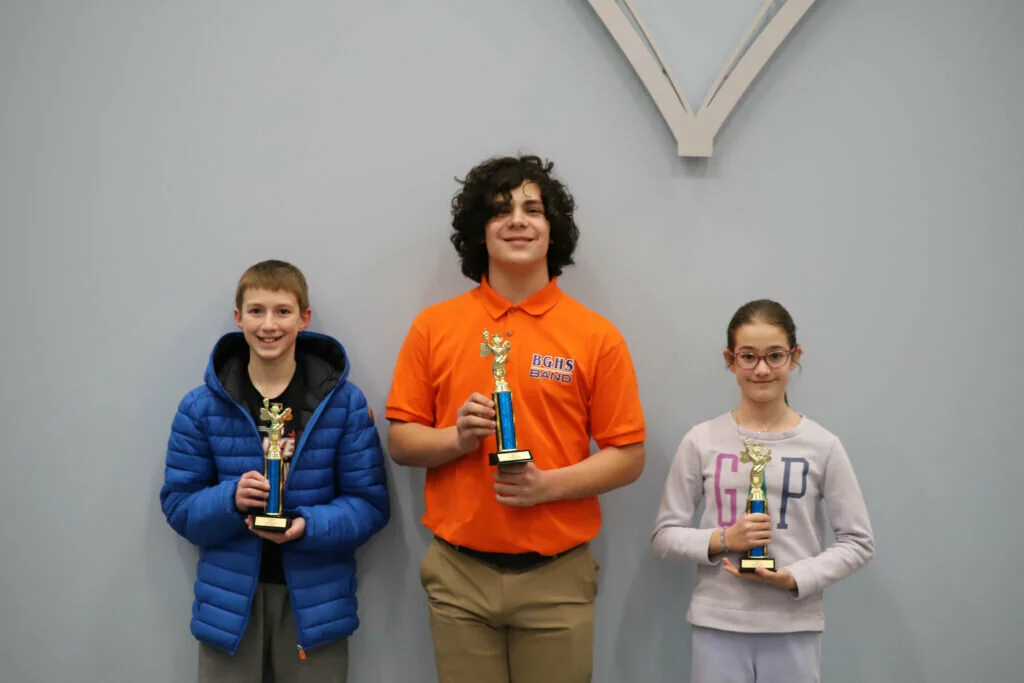 From left: Mason B., a seventh grader at London Middle School; Will C., an eighth grader at Cooper Middle School; and Nina K., a fifth grader at Poe Elementary School, were the top three finishers for the District 21 Spelling Bee