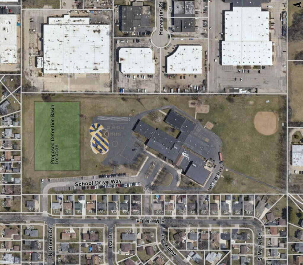 An aerial view of Twain Elementary School and its surrounding neighborhood. There is an outline along the left-hand side of a proposed stormwater management facility.