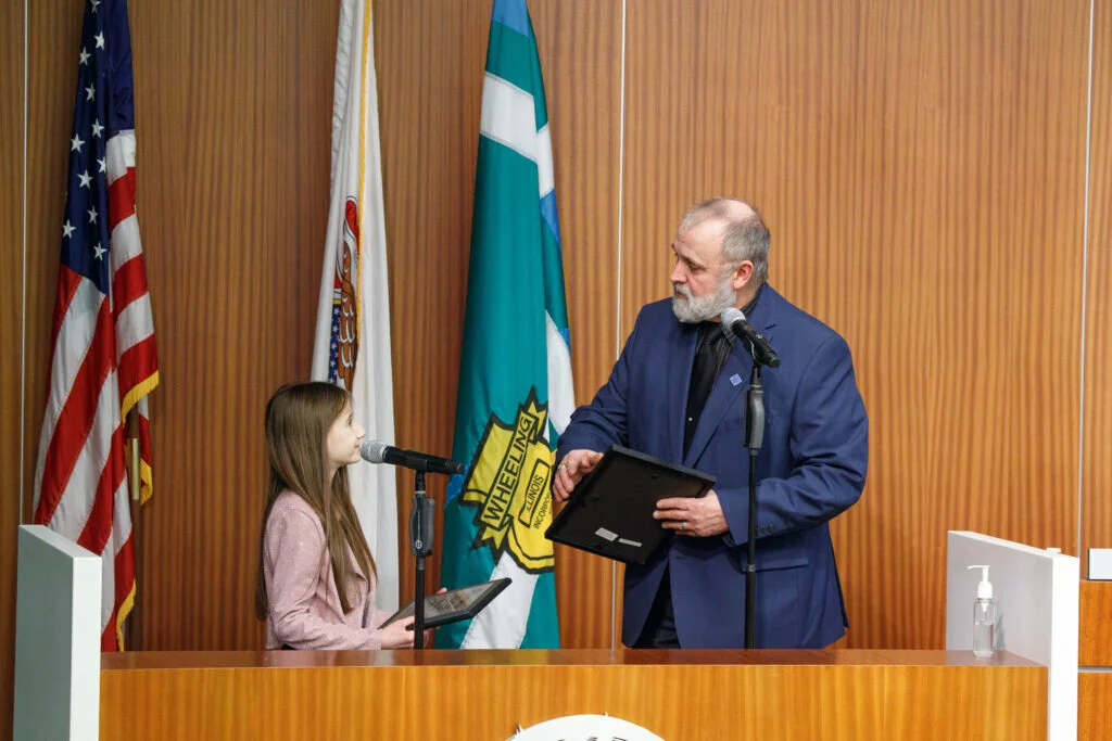 Maya and Horcher speak before he presents her the award