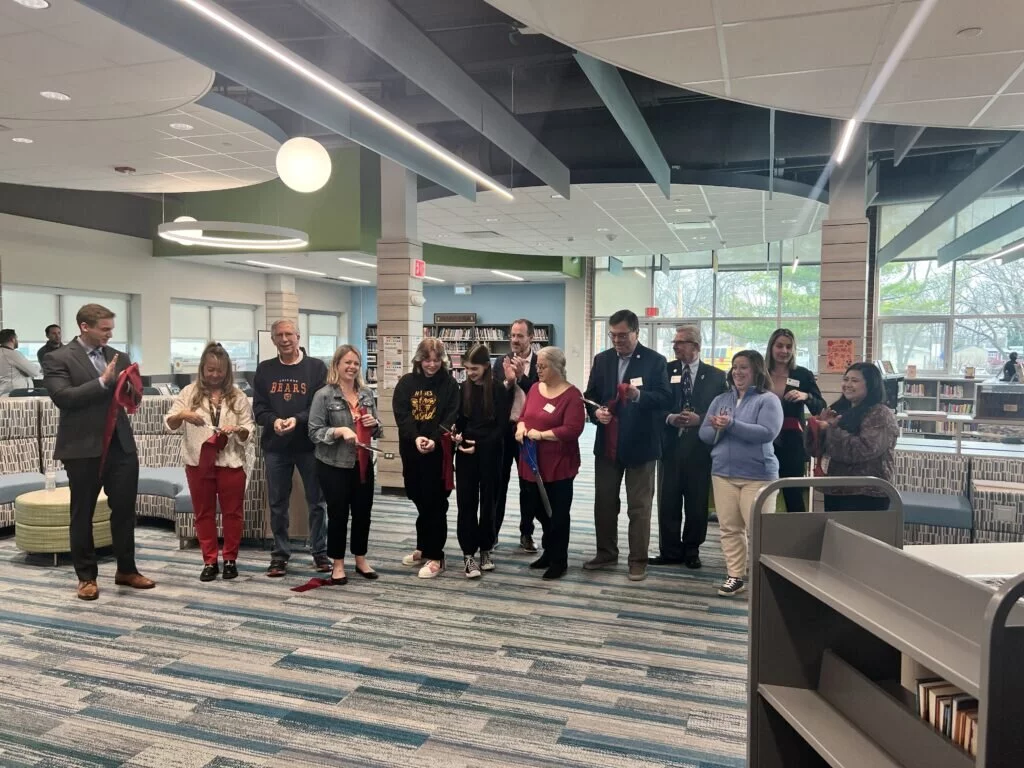 The ribbon is cut to commemorate the opening of Holmes' renovated LMC
