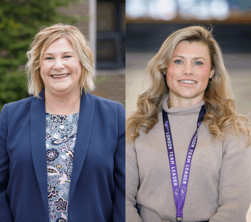 Two women are side by side, each smiling. The left woman has short blonde hair, wearing a floral top and blue jacket. The right has wavy hair and a lanyard.