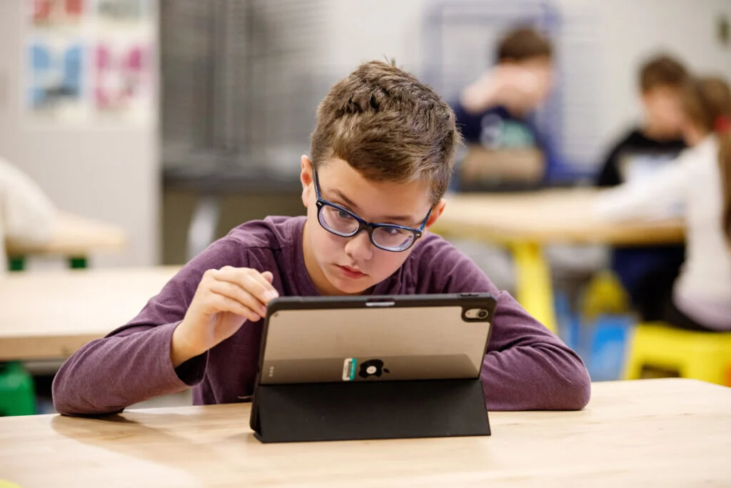 A Riley student sketches away during art class.